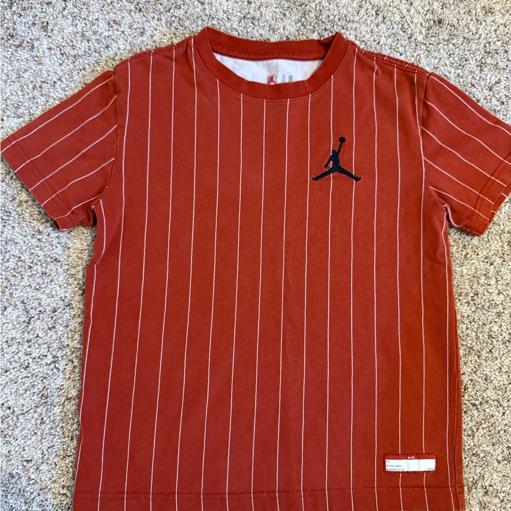 Jordan burnt orange striped T-shirt.